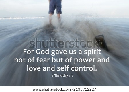 Bible verse quote - For God gave us a spirit not of fear but of power and love and self control. 2 Timothy 1:7 With person standing alone on strong waves motion on beach. Christianity words.