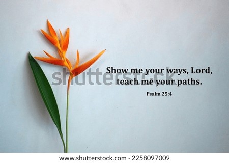 Bible verse quote - Show me your ways, Lord, teach me your paths. Psalm 25:4 On white wall background with bird of paradise flower and leaf decoration. Christianity concept.