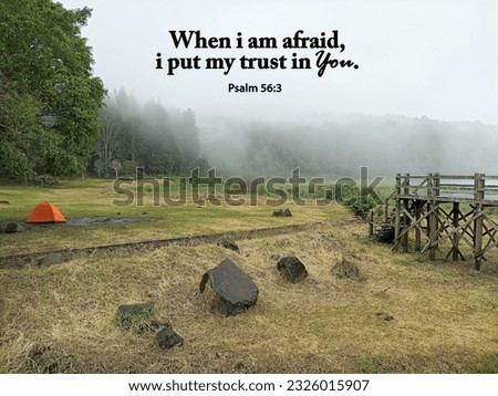 Bible verse quote - When i am afraid, i put my trust in You. Psalm 56:3 On a foggy background over camp area. Christianity religious concept. Believe in God.