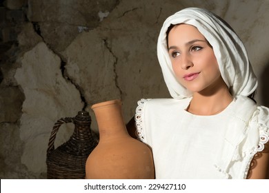 Biblical Portrait Of A Woman Depicting Mother Mary Holding A Wine Jug