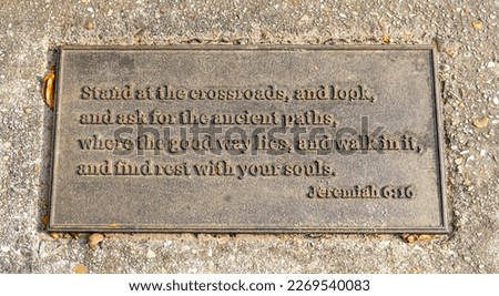Biblical quotation on a sidewalk plaque regarding the good path, from the book of Jeremiah