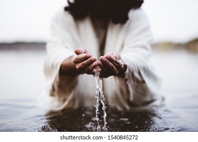 A biblical scene - of Jesus Christ drinking water with his hands - Shutterstock ID 1540845272