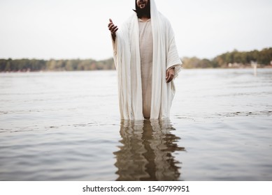 A biblical scene - of Jesus Christ landing a hand for help while standing in the water
