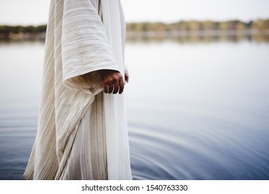 A biblical scene - of Jesus Christ walking in the water with a blurred background - Shutterstock ID 1540763330