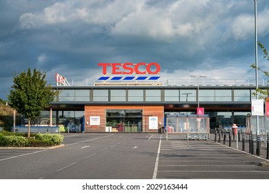 Bicester,England-August 2021:Tesco supermarket sign atop a store exterior at Bicester town