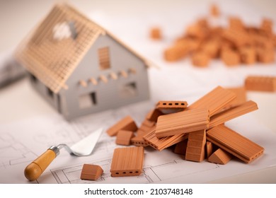 Bicks and project for construction industry.Building house concept - Shutterstock ID 2103748148