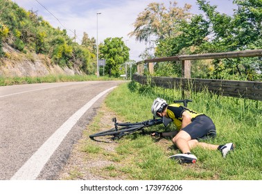 Bicycle Accident On The Road - Biker In Troubles - Concept Of Sport Failure And Defeat During Race Competition