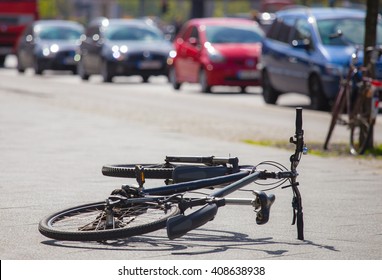 a bicycle is after an accident on the sidewalk