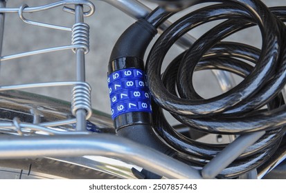 Bicycle anti-theft cable with combination lock close-up. selective focus - Powered by Shutterstock