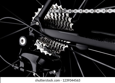 bicycle bike rear derailleur gear casette chain detail close up shot black dark background