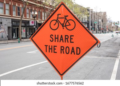 Bicycle And Car Share Warning Sign On The Road Work Zone