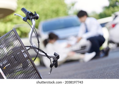 Bicycle and car traffic accident - Shutterstock ID 2038197743