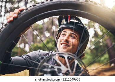 Bicycle, cycling and man check tire quality, pressure or stability for nature travel, exercise or fitness training. Mountain bike sports person checking wheel for health workout in Canada forest park - Powered by Shutterstock