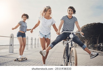 Bicycle, friends and skateboard with women in summer for sports, fun and holiday break. Health, joy and wellness with cyclists riding bike on promenade for playful, Miami travel and energy together - Powered by Shutterstock