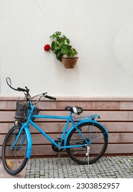 Bicycle in front of a wall composition