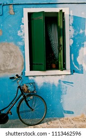 a bicycle in front of a window