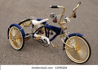 Bicycle has three wheels modified with gold and silver