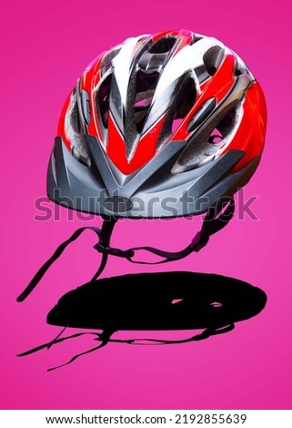 bicycle helmet isolated on a pink background. Cycling safely