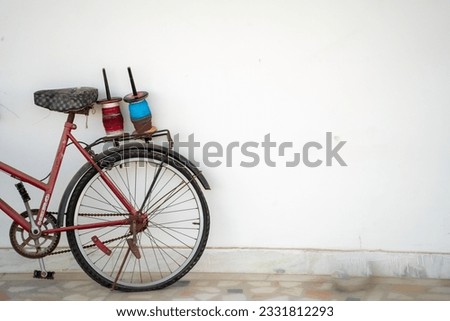 bicycle with kite flying thread spools charkhi on the carrier showing the celebrations of this festival in rajasthan gujarat delhi india with copy space