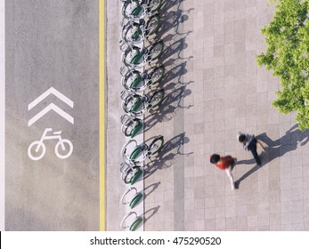 Bicycle Lane Signage With Bicycle Parking On Street People Walking Urban City Top View