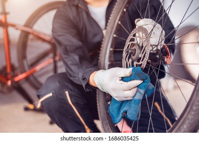 Bicycle Maintenance, Rider Is Wiping The Bike Clean, Close-up.