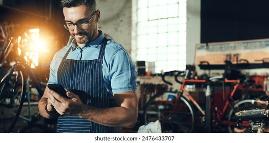 Bicycle, man and phone for shop, garage and small business of mechanic, engineer or entrepreneur. Proud, owner or person with service maintenance for bike, inspection or transport with mobile app - Powered by Shutterstock