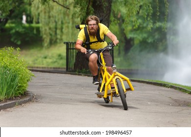 Bicycle Messenger With Cargo Bike Speeding For Delivery