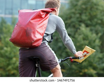 Bicycle Messenger - Commuter With Bicycle In Berlin