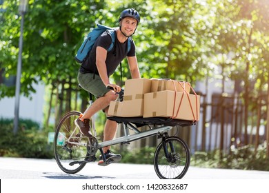 Bicycle Messenger Making A Delivery on A Cargo Bike