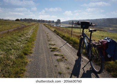 Bicycle On Dyke On The Elbe Bike Lane In Background The German River Elbe Near The The German Town Lenzen, It Is Also The Iron Curtain Trail