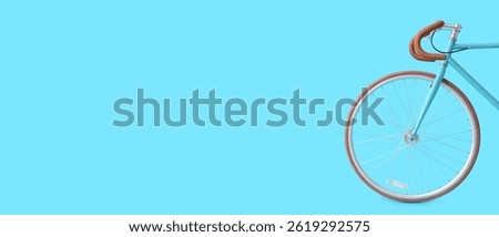 Bicycle on light blue background with space for text