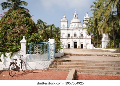 Bicycle Outside The Church Of St Alex, A Large Catholic Christian Church In Calangute, North Goa, India