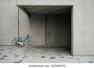 Bicycle parked near entrance of modern building