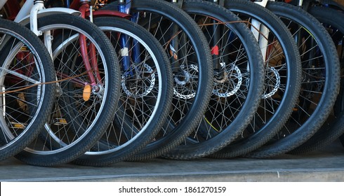 Bicycle Parking. Bike Shop. Bicycle Repair And Maintenance. Lots Of Bicycle Wheels.