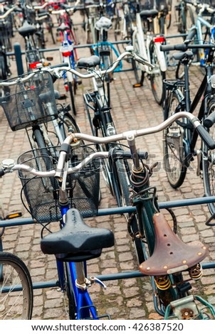 Similar – Fahrräder in der Nähe von niederländischen Häusern in Amsterdam City