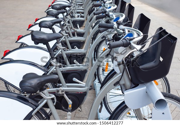 Bicycle. Parking lot. Bicycle hire. Modern bike\
rental. Bicycle hire station. Bike rental in minutes. Instant hire.\
Caring for the environment. Green transport. Eco-friendly car\
rental.
