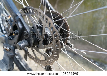 bicycle parts rear wheel brake disc cassette fragment frame - across