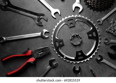 Bicycle Parts And Repair Tools On Gray Background