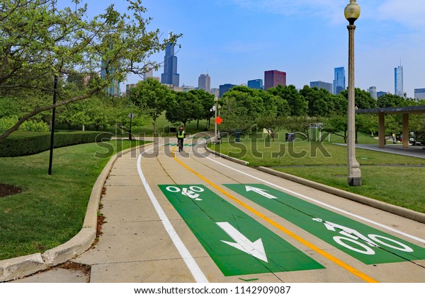 The bicycle path in downtown Chicago along\
the lakefront now has painted lane dividers, and directional arrows\
for better flow, and rider\
control.