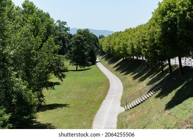 Bicycle Path Through The Park. Urban Green Area On A Hot Sunny Day.