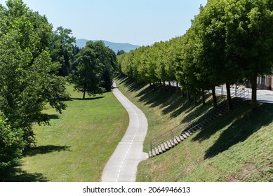 Bicycle Path Through The Park. Urban Green Area On A Hot Sunny Day.