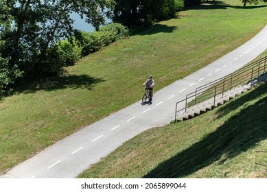 Bicycle Path Through The Park. Urban Green Area On A Hot Sunny Day.