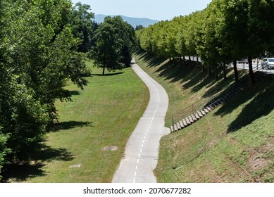 Bicycle Path Through The Park. Urban Green Area On A Hot Sunny Day.