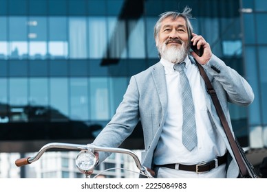 Bicycle, Phone And Asian Businessman In City Talking, Speaking And Listening On Phone Call. Travel, Eco Friendly Transport And Mature Asian Man With Smartphone And Bike For Low Carbon Footprint