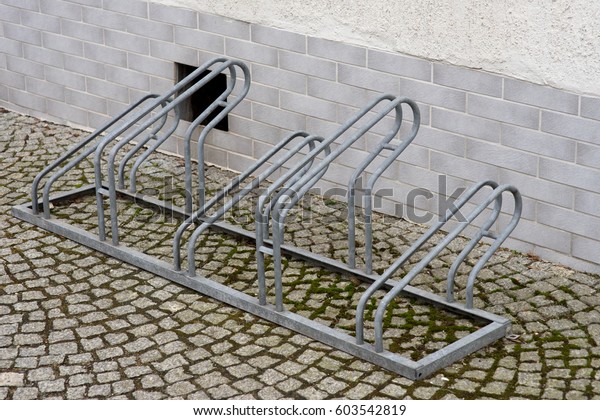 Bicycle rack made\
of metal for several\
bicycles