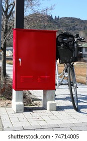 Bicycle and red post box