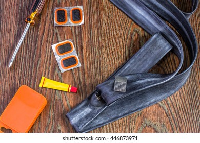 Bicycle Repair Kit, Wheels Camera On  Wooden Background