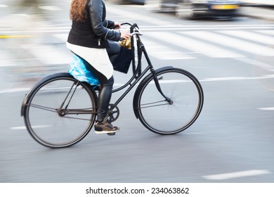 Bicycle Rider In A Dutch City In Motion Blur