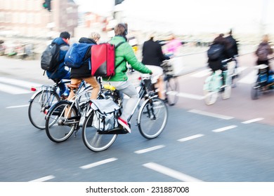 Bicycle Riders In The City Traffic In Motion Blur