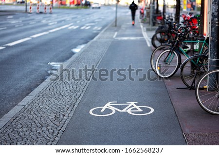 Bicycle sign on a red bike path in Europe